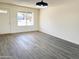 Entryway into a spacious living room with luxury vinyl plank flooring and lots of natural light at 2018 W Western Dr, Chandler, AZ 85224
