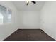 Bright bedroom with a ceiling fan, neutral walls, and window letting in natural light at 2033 W Adams St, Phoenix, AZ 85009