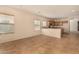 Open concept living room featuring tile flooring, recessed lighting, and large windows at 21333 N Denton Dr, Maricopa, AZ 85138