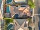 Aerial view showcasing the community, swimming pools, and solar panels at 2134 E Honeysuckle Pl, Chandler, AZ 85286