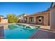 A sparkling pool is surrounded by mature landscaping and an arched veranda at 2134 E Honeysuckle Pl, Chandler, AZ 85286