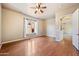 Bedroom featuring hardwood flooring, ceiling fan, and an arched doorway at 2134 E Honeysuckle Pl, Chandler, AZ 85286