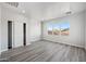 Bright bedroom with wood-look floors and a large window at 2134 E Honeysuckle Pl, Chandler, AZ 85286