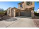 Home featuring a long driveway leading to a spacious three-car garage at 2134 E Honeysuckle Pl, Chandler, AZ 85286