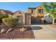 Charming two-story home featuring a desert landscaped yard and a two car garage at 2134 E Honeysuckle Pl, Chandler, AZ 85286