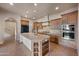 Gourmet kitchen featuring granite countertops, stainless steel appliances, and custom cabinetry at 2134 E Honeysuckle Pl, Chandler, AZ 85286