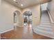 Open living area featuring archways, staircase, and tile flooring at 2134 E Honeysuckle Pl, Chandler, AZ 85286