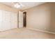 This carpeted bedroom showcases a double door closet providing lots of storage space at 2453 E Ebony Dr, Chandler, AZ 85286