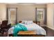 Bright bedroom featuring hardwood floors and natural light from two windows at 2453 E Ebony Dr, Chandler, AZ 85286