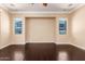 Bedroom with wood flooring, neutral paint, crown moulding, and view of backyard at 2453 E Ebony Dr, Chandler, AZ 85286