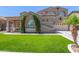 Stylish single Gathering house with desert landscaping, large window, and attached two car garage at 2453 E Ebony Dr, Chandler, AZ 85286
