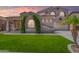 Charming two-story home featuring a landscaped yard and neutral tones at 2453 E Ebony Dr, Chandler, AZ 85286