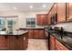 Kitchen showcasing stainless steel appliances, granite countertops, and ample cabinet space at 2453 E Ebony Dr, Chandler, AZ 85286