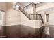 Open concept living space with dark wood flooring, two story ceilings, and staircase at 2453 E Ebony Dr, Chandler, AZ 85286