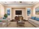 Comfortable living room with neutral tones, plush seating, and modern entertainment setup at 2453 E Ebony Dr, Chandler, AZ 85286