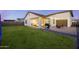 A well-manicured backyard with cozy covered patio featuring comfortable seating at 25658 N 140Th Ln, Surprise, AZ 85387