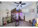 Fun room with ceiling fan, a lofted bed and ample space for play and storage at 25658 N 140Th Ln, Surprise, AZ 85387