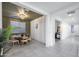 Elegant dining area with a modern chandelier, with neutral walls and tile flooring at 25658 N 140Th Ln, Surprise, AZ 85387