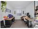 Functional home office with dual workstations and a large window for natural light at 25658 N 140Th Ln, Surprise, AZ 85387