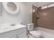 Bright bathroom featuring a single sink vanity and tiled shower at 25723 S Hawes Rd, Queen Creek, AZ 85142
