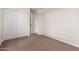 Bedroom featuring neutral carpet and paint with closet at 25723 S Hawes Rd, Queen Creek, AZ 85142