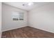 Bedroom with a window and wood-look flooring at 25723 S Hawes Rd, Queen Creek, AZ 85142