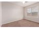 Bedroom featuring a ceiling fan and window at 25723 S Hawes Rd, Queen Creek, AZ 85142