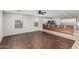 Open-concept living space with hardwood floors and bright kitchen view at 25723 S Hawes Rd, Queen Creek, AZ 85142