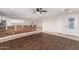 Open-concept living space with hardwood floors and bright kitchen view at 25723 S Hawes Rd, Queen Creek, AZ 85142
