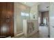 Shower with sleek glass partition, pebble floor, and spa-like fixtures at 2621 S 157Th Dr, Goodyear, AZ 85338