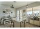 Bright kitchen with a dining area featuring a decor wall and backyard access through glass doors at 2621 S 157Th Dr, Goodyear, AZ 85338