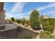 Landscaped backyard with gravel, plants, and desert landscaping at 26616 W Quail Ave, Buckeye, AZ 85396