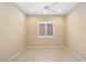 Bedroom with a ceiling fan, and neutral walls at 26616 W Quail Ave, Buckeye, AZ 85396
