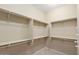 Walk-in closet with multiple levels of shelving for optimal organization and storage at 26616 W Quail Ave, Buckeye, AZ 85396