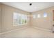 Neutral dining area featuring large window with plantation shutters at 26616 W Quail Ave, Buckeye, AZ 85396