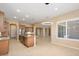 Open concept dining area with light walls, plantation shutters, and modern light fixture at 26616 W Quail Ave, Buckeye, AZ 85396