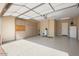 Spacious garage with epoxy floors and built-in storage cabinets at 26616 W Quail Ave, Buckeye, AZ 85396