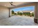 Covered patio with stone tile flooring offers a great space for outdoor relaxation at 26616 W Quail Ave, Buckeye, AZ 85396