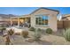 Charming backyard featuring a covered patio, lush landscaping, and a tranquil outdoor living space at 26828 W Piute Ave, Buckeye, AZ 85396