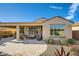 Stunning backyard with covered patio, comfortable seating, and desert landscaping for relaxing outdoor living at 26828 W Piute Ave, Buckeye, AZ 85396