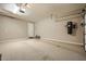 Spacious garage with epoxy flooring and ample storage, providing a clean and functional space for vehicles and tools at 26828 W Piute Ave, Buckeye, AZ 85396