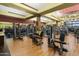 Spacious community gym with modern exercise equipment, wood-style flooring, and large windows at 26828 W Piute Ave, Buckeye, AZ 85396