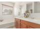 Bright bathroom with double sinks and a bathtub at 28933 N Saddle Way, San Tan Valley, AZ 85143