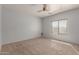 Comfortable bedroom with carpet and a ceiling fan at 28933 N Saddle Way, San Tan Valley, AZ 85143