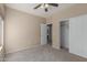 Neutral bedroom with closet and entry doorway showcases carpeted floors and natural light at 28933 N Saddle Way, San Tan Valley, AZ 85143