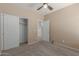 Bedroom with sliding closet doors and entry doorway showcases carpeted floors and natural light at 28933 N Saddle Way, San Tan Valley, AZ 85143