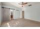Bedroom featuring modern accents and bathroom access through barn door at 28933 N Saddle Way, San Tan Valley, AZ 85143