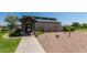 Exterior of community center showcasing the landscaping and entrance at 28933 N Saddle Way, San Tan Valley, AZ 85143