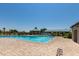 Large community pool with sunshades and ample seating at 28933 N Saddle Way, San Tan Valley, AZ 85143