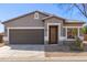 Inviting home exterior with a neutral color scheme, two car garage, and a welcoming front entrance at 28933 N Saddle Way, San Tan Valley, AZ 85143